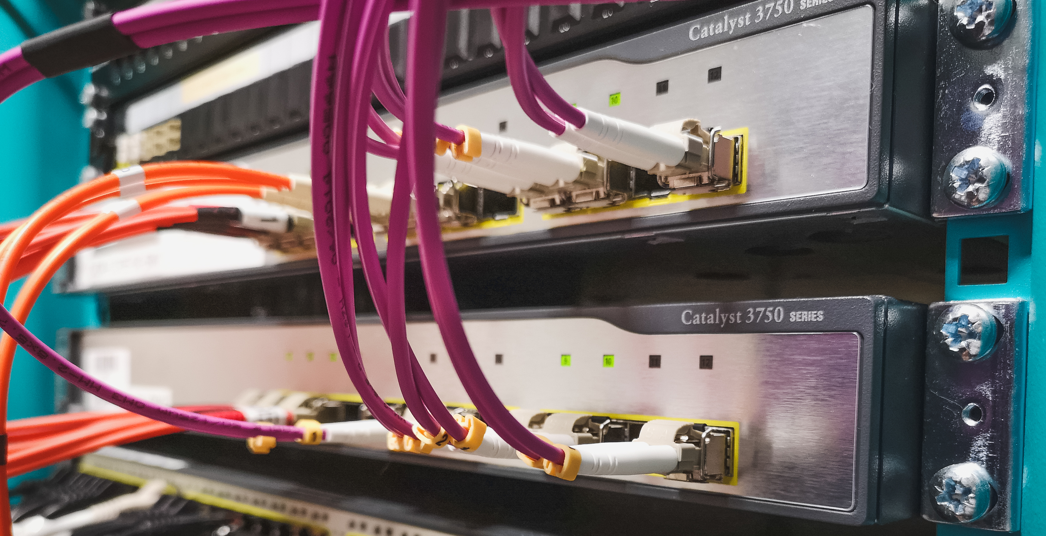 Cisco 3750 switches provide fibre connectivity with purple and orange patch cables. Are these old switches ready for an infrastructure upgrade?